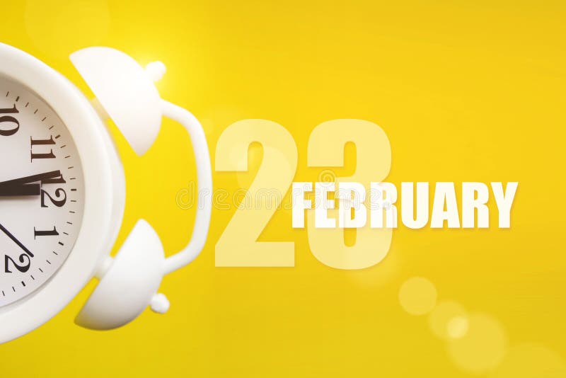 February 23rd Day 23 Of Month Calendar Date White Alarm Clock On