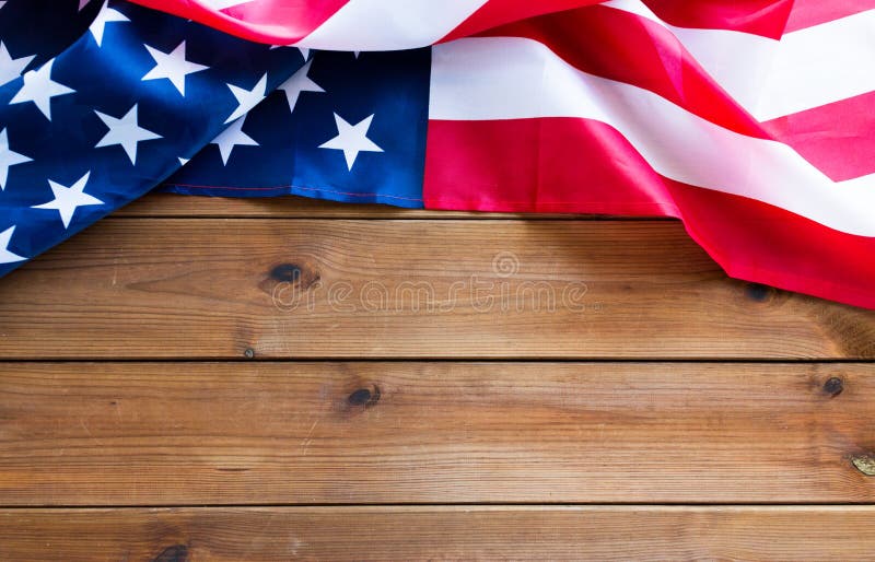 American independence day, patriotism, national and memorial concept - close up of american flag on wooden boards with copy space. American independence day, patriotism, national and memorial concept - close up of american flag on wooden boards with copy space
