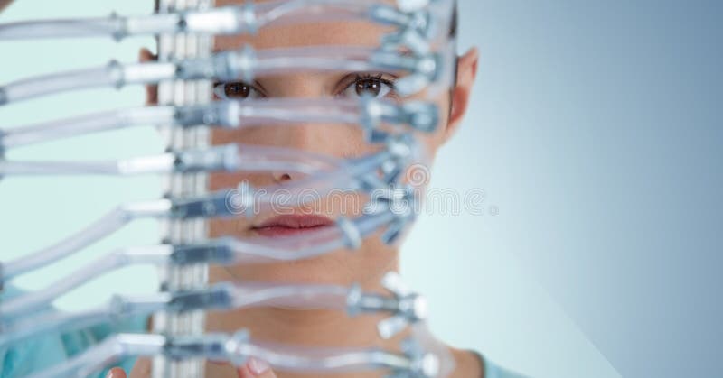 Feche acima da mulher com a eletrônica contra o fundo azul fotografia de stock Feche acima da mulher com a eletrônica contra o fundo azul fotografia de stock