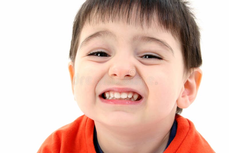Feche acima do sorriso do menino da criança imagem de stock Feche acima do sorriso do menino da criança imagem de stock