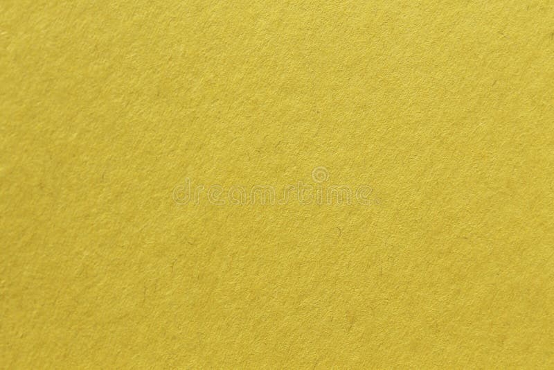 Feche a macro-captura de papel amarelo de construção mostrando textura em fibras de papel impermeáveis e muito mais. a imagem perf