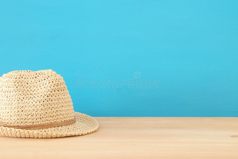 Fedora hat over wooden table. stock image Fedora hat over wooden table. stock image