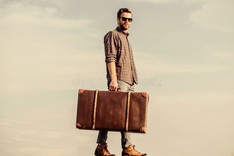 Feed your wanderlust. businessman in glasses. business trip. male fashion style. looking so trendy. traveler wait for flight. Move. macho man tourist tour bag. sexy man sky background.