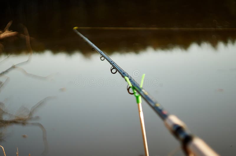 Feeder Fishing Rod on the Stand Against the Background of the River.  Closeup Stock Image - Image of water, reel: 183619723