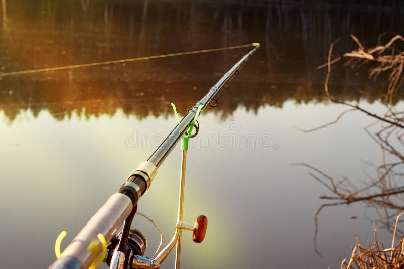Feeder Fishing Rod on the Stand Against the Background of the River.  Closeup Stock Image - Image of water, reel: 183619723