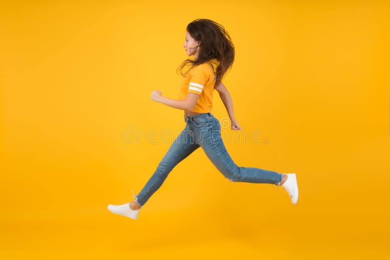 Full Length Body Size Side Profile Photo Jumping High Beautiful She Her  Lady Hands Arms Up Win Game Play Match Wearing Casual Jeans Denim White  Tshirt Clothes Isolated Yellow Bright Vivid Background