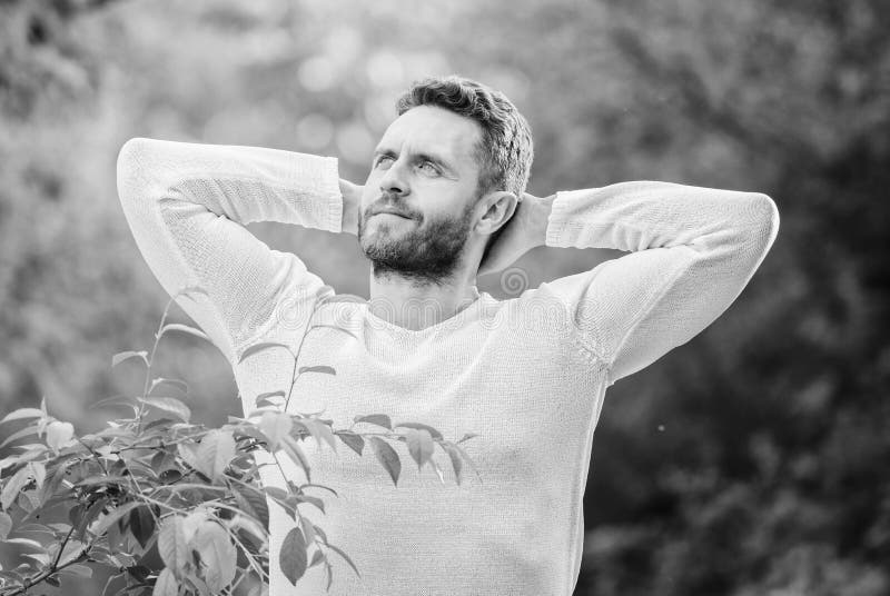 Feel power of nature. Man handsome bearded guy morning stretching nature background. Meet new day. Nature peaceful royalty free stock images Feel power of nature. Man handsome bearded guy morning stretching nature background. Meet new day. Nature peaceful royalty free stock images