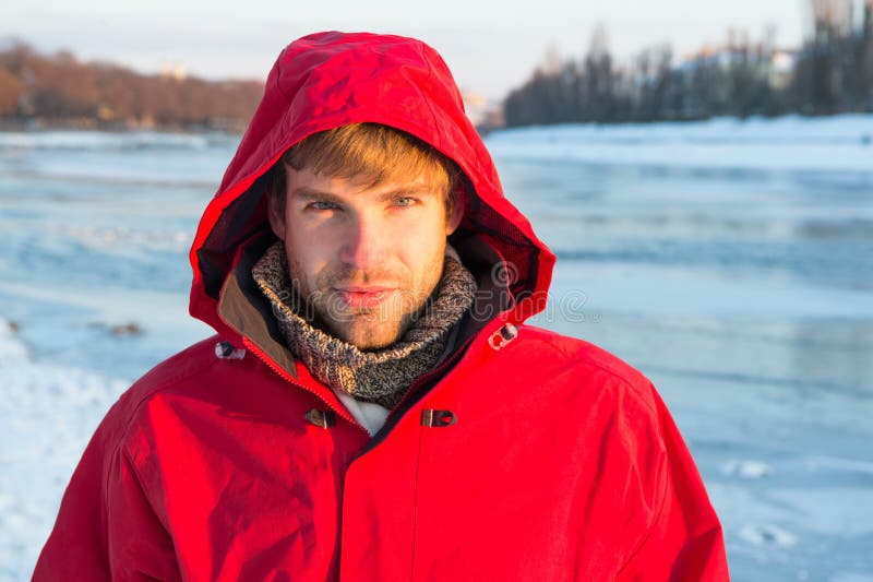 Feeling frosty. man enjoy snowy landscape in sunset. travel and expedition concept. man in red parka. winter male stock photo Feeling frosty. man enjoy snowy landscape in sunset. travel and expedition concept. man in red parka. winter male stock photo