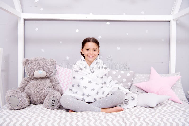 Feeling good at home. Tidy bedroom. Cute cozy bedroom for small girl. Girl having fun bedroom interior. Childhood royalty free stock image Feeling good at home. Tidy bedroom. Cute cozy bedroom for small girl. Girl having fun bedroom interior. Childhood royalty free stock image