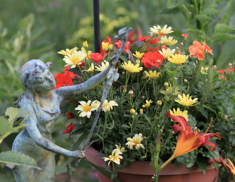 Fairy Garden miniature garden at Summer Tour in the Country near Blair, Nebraska. The event was hosted by the UNL Extension and the Blair Horticultural Society. This planting features a garden statue. Fairy Garden miniature garden at Summer Tour in the Country near Blair, Nebraska. The event was hosted by the UNL Extension and the Blair Horticultural Society. This planting features a garden statue.