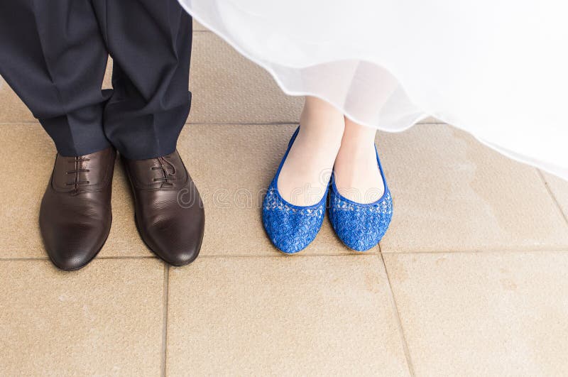 Feet of bride and groom, wedding shoes close-up
