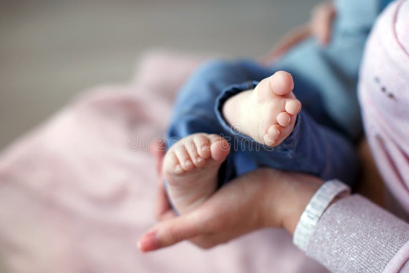 Feet of newborn baby on mother`s palm royalty free stock photography Feet of newborn baby on mother`s palm royalty free stock photography