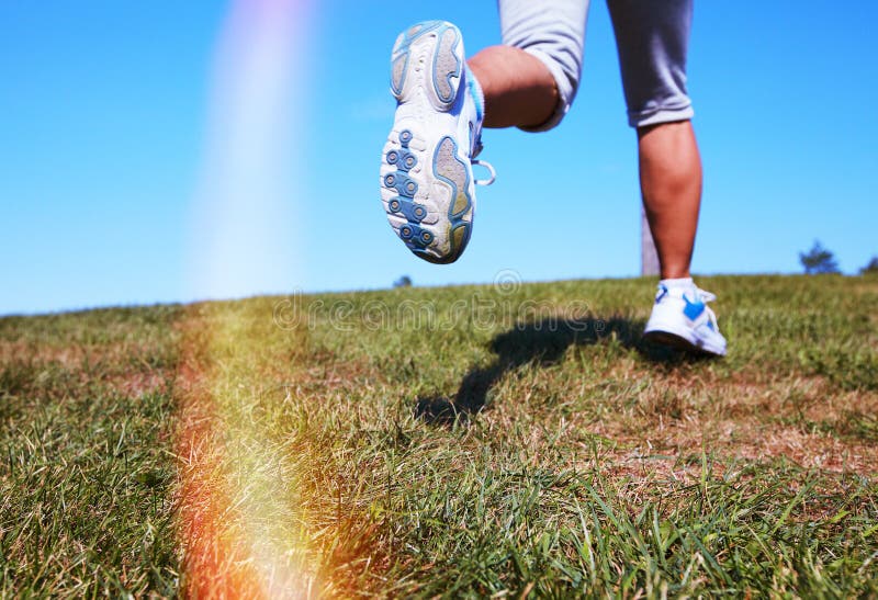 Feet of running woman. royalty free stock images