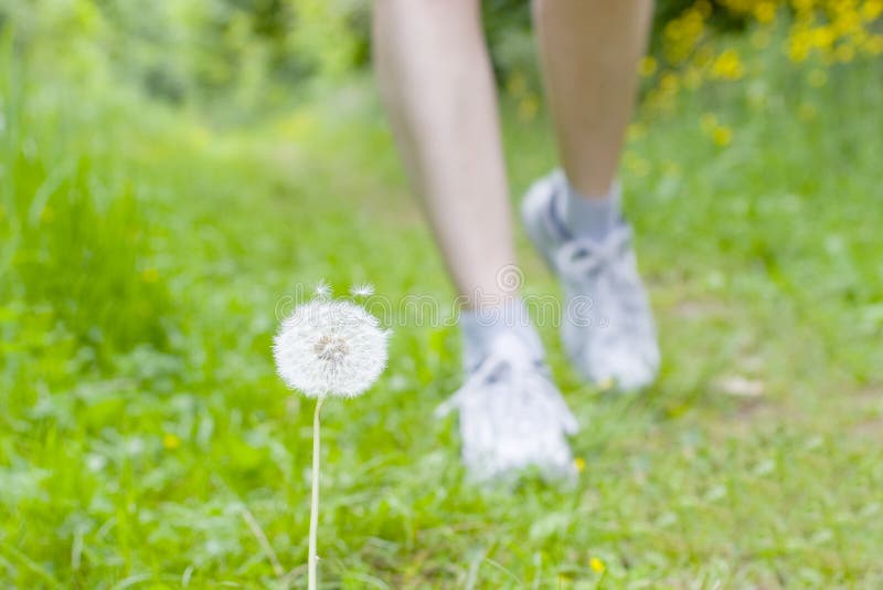 Feet of a running woman