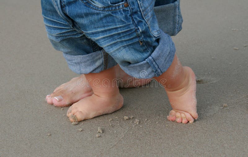 Feet on sand - first baby s step