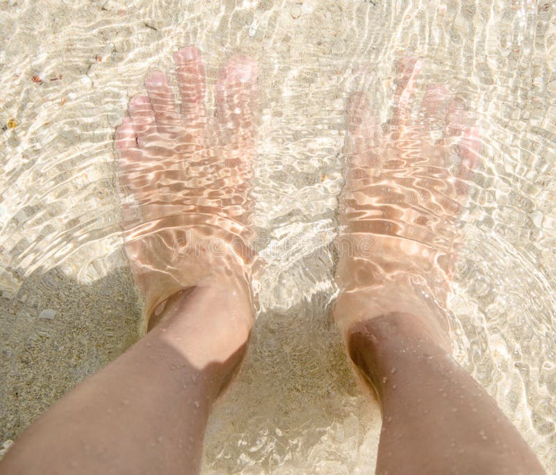 Feet sand sea and me stock image