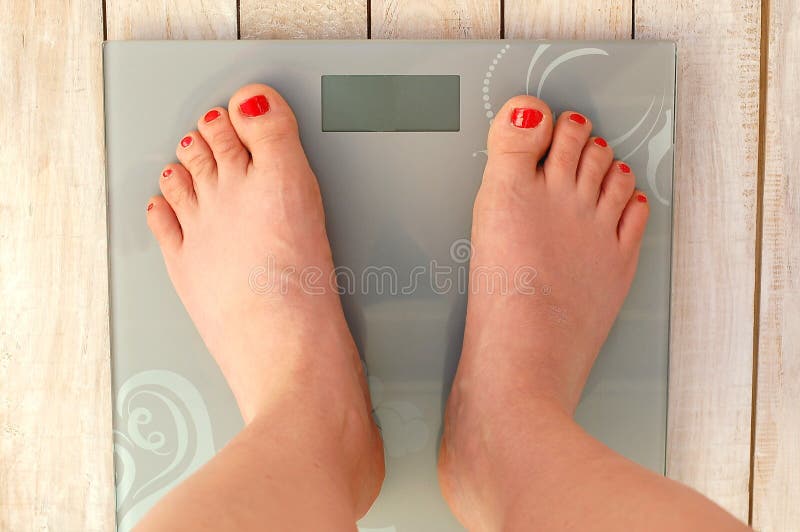 Feet on scales chained stock photo. Image of bare, girl 17899634