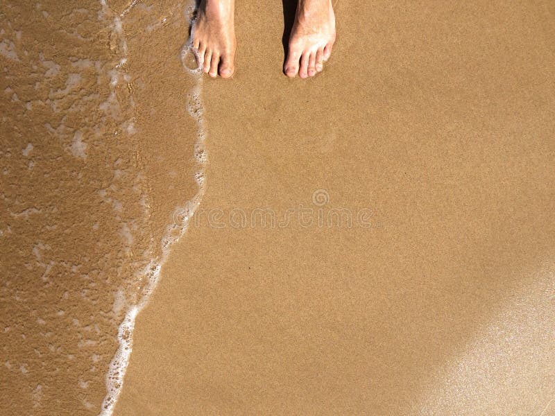 Feet on the seashore, ocean, Maui Hawaii USA