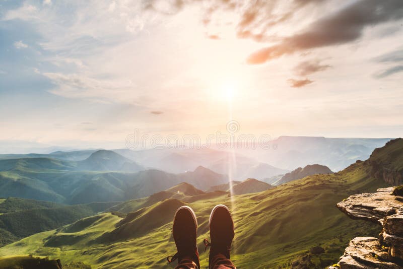 Feet Selfie hipster shoes Traveler relaxing on cliff mountains outdoor with aerial sunset evening view mountains on background stock images Feet Selfie hipster shoes Traveler relaxing on cliff mountains outdoor with aerial sunset evening view mountains on background stock images
