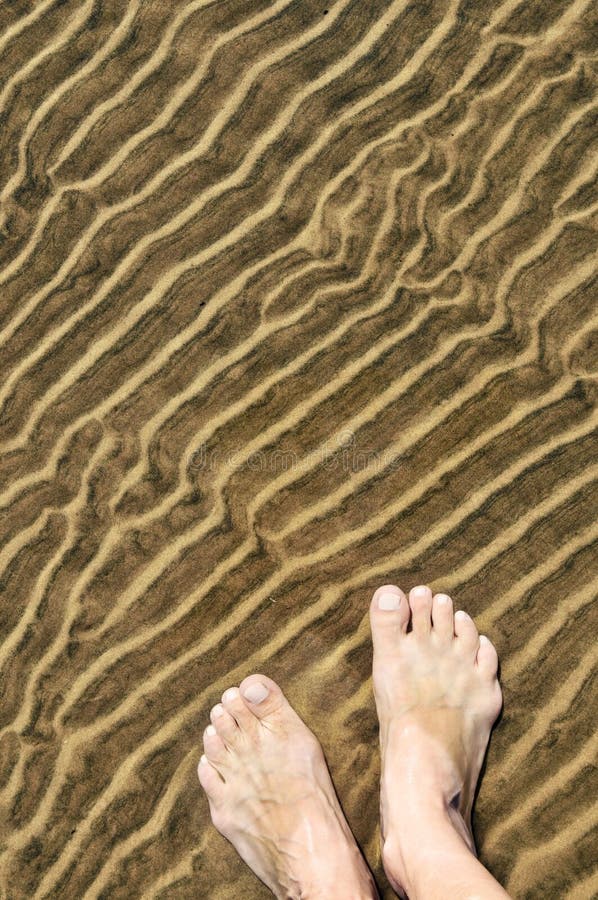 Feet in shallow water