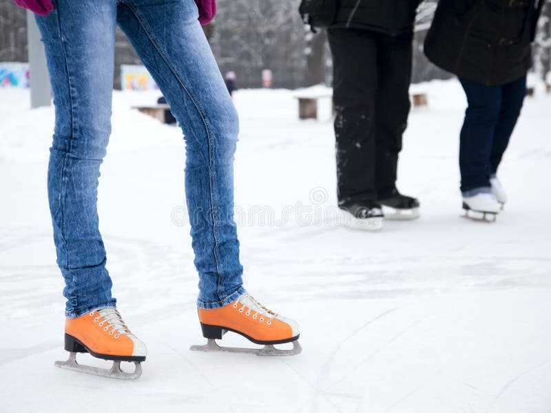 The skaters feet while standing on ice. The skaters feet while standing on ice