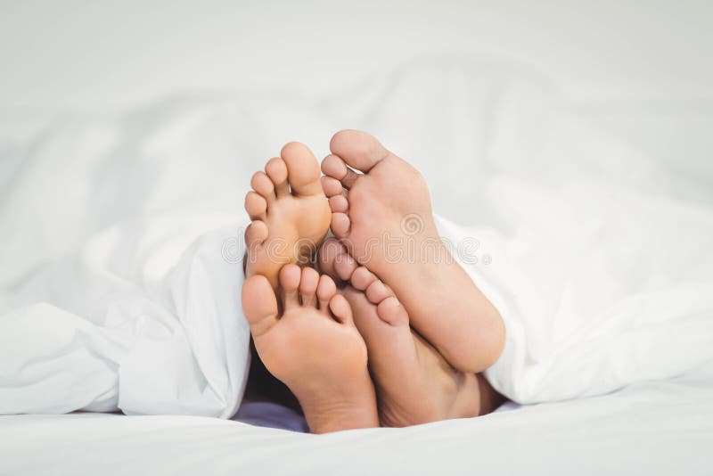 163 Feet Sticking Out Blanket Stock Photos Free & RoyaltyFree Stock Photos from Dreamstime