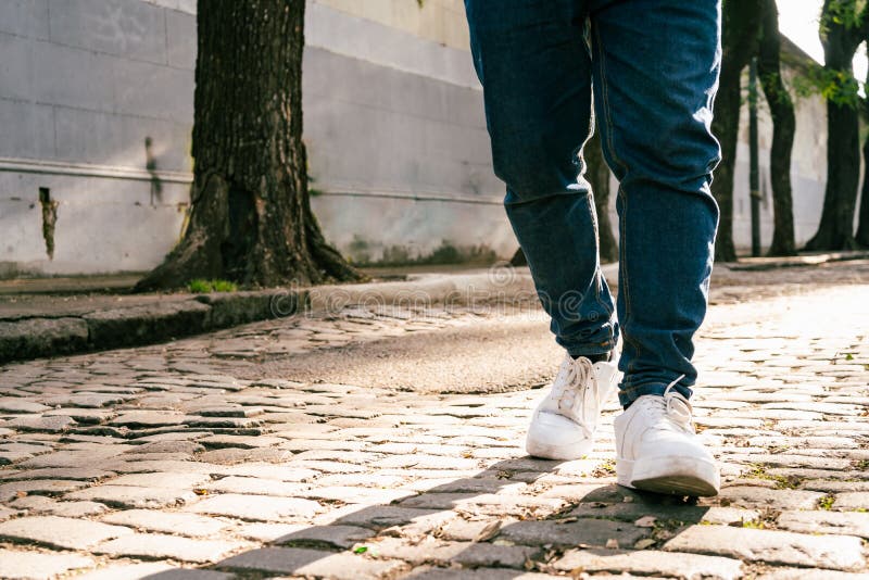 Feet of Unrecognizable Man Walking Down the Street. Copyspace Stock ...