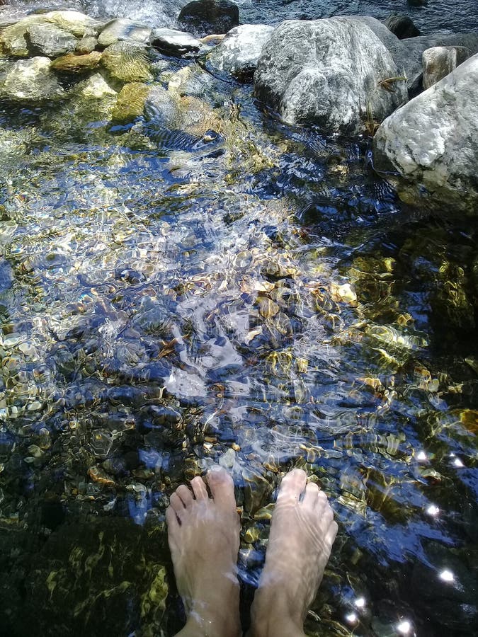 Feet in the water stock photo. Image of aqua, landscape - 140610978