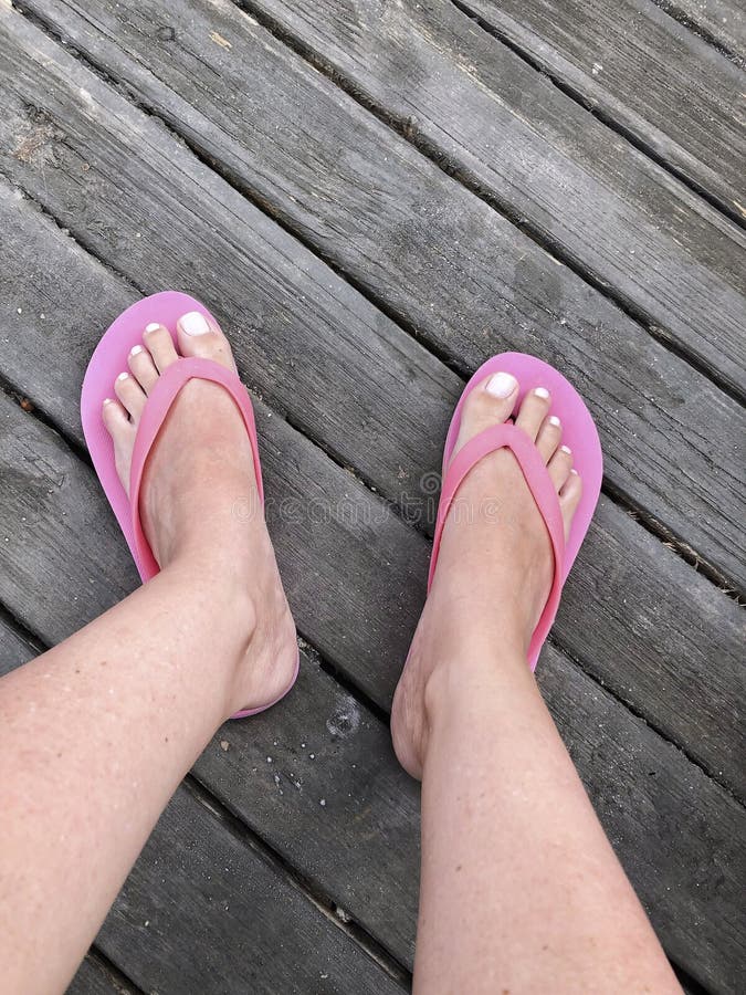 Feet of a Woman Wearing Pink Flip Flops Stock Image - Image of holiday ...