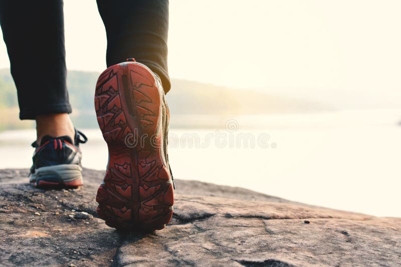 Feet women walking in nature background