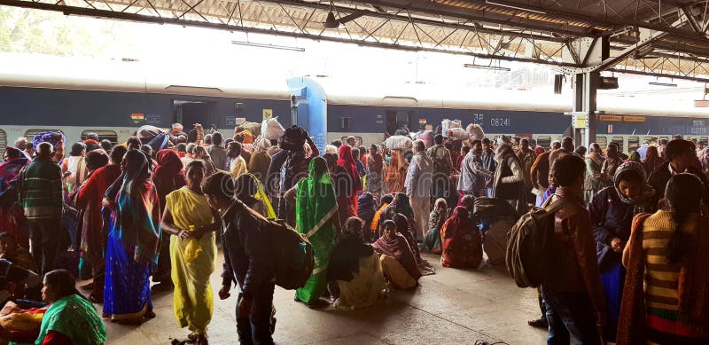 Prayag, India - February 4, 2019: World`s largest religious gathering Kumbh Fair. Millions of Hindu pilgrimages are waiting for the respective train at Prayag railway station. Prayag, India - February 4, 2019: World`s largest religious gathering Kumbh Fair. Millions of Hindu pilgrimages are waiting for the respective train at Prayag railway station.