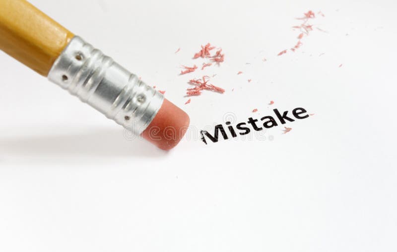 Macro of a pencil eraser fixing a mistake. Macro of a pencil eraser fixing a mistake