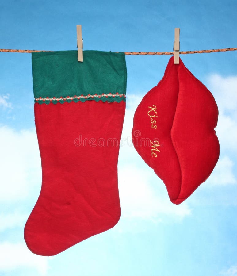 Happy Merry X mas Hanging christmas decoration red hart and santa socks. Happy Merry X mas Hanging christmas decoration red hart and santa socks.