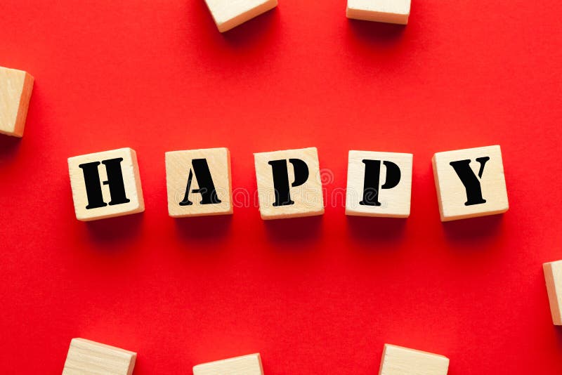 Feliz escrito em cubos imagem de stock Feliz escrito em cubos imagem de stock