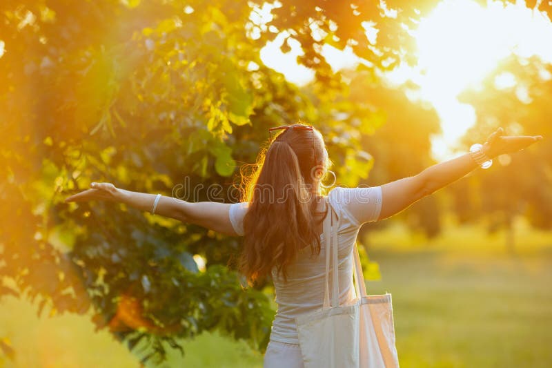 Summer time. happy stylish middle aged woman in white shirt rejoicing outdoors. Summer time. happy stylish middle aged woman in white shirt rejoicing outdoors