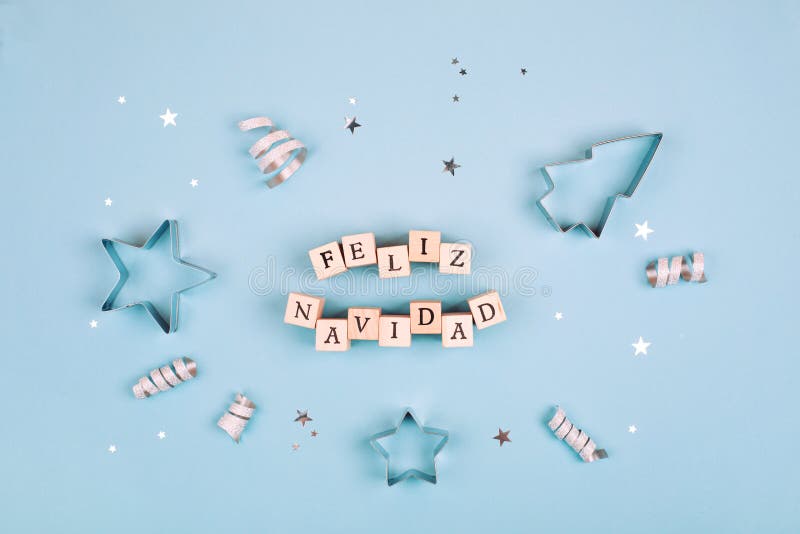 Feliz Navidad text on pastel blue background