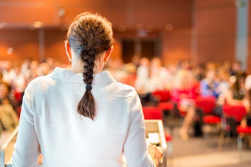 Female academic professor lecturing at faculty.