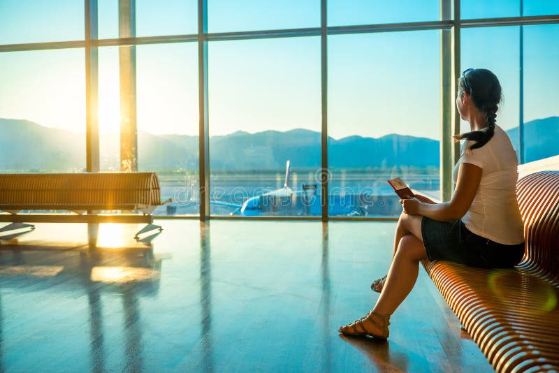 Female at the airport waiting for boarding