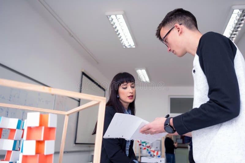 Female Architecture Teacher at Work. Female Professor Explain Architectural Projects To Students