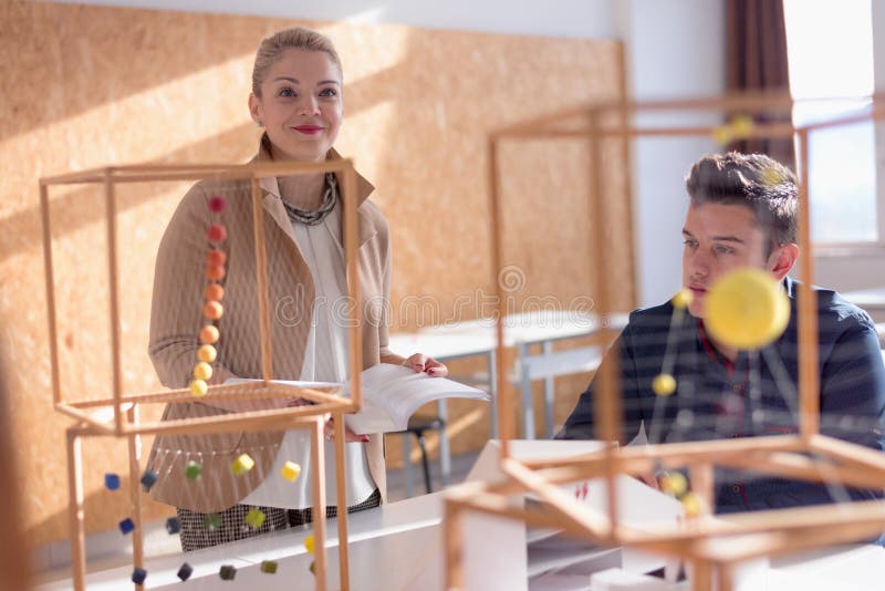 Female Architecture Teacher at Work. Female Professor Explain Architectural Projects To Students