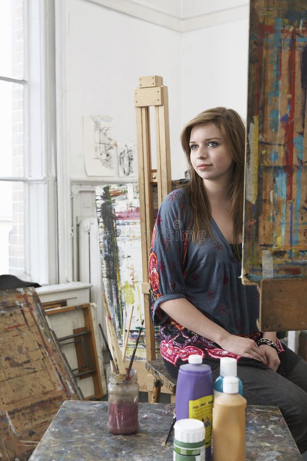 Female Artist Sitting In Art Studio Stock Photography