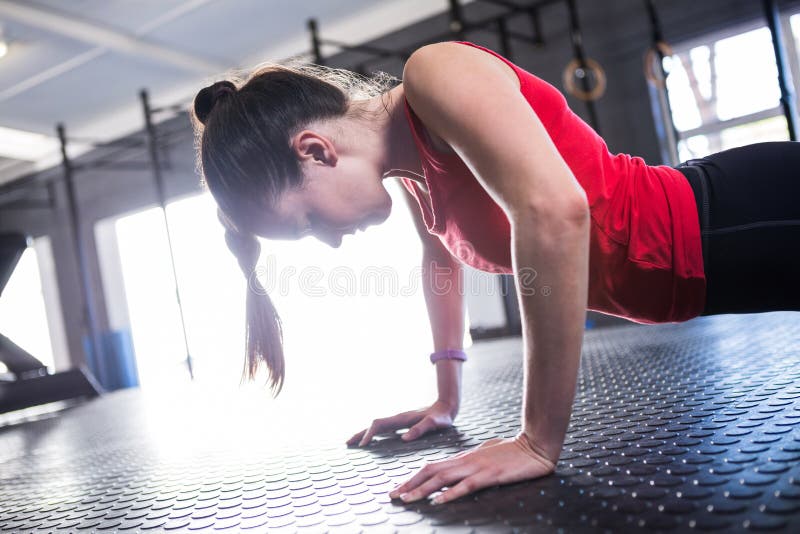 Female Athlete Doing Pushups in Gym Stock Image Image of side