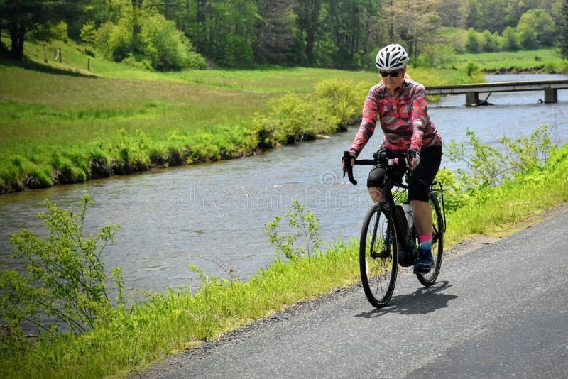 Female baby boomer enjoying e-bike ride