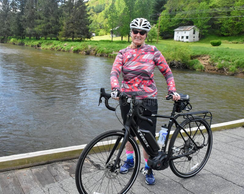 Female baby boomer enjoying e-bike ride