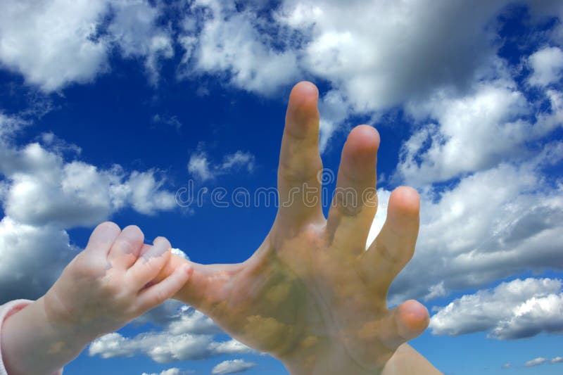 Female and baby hand on sky background