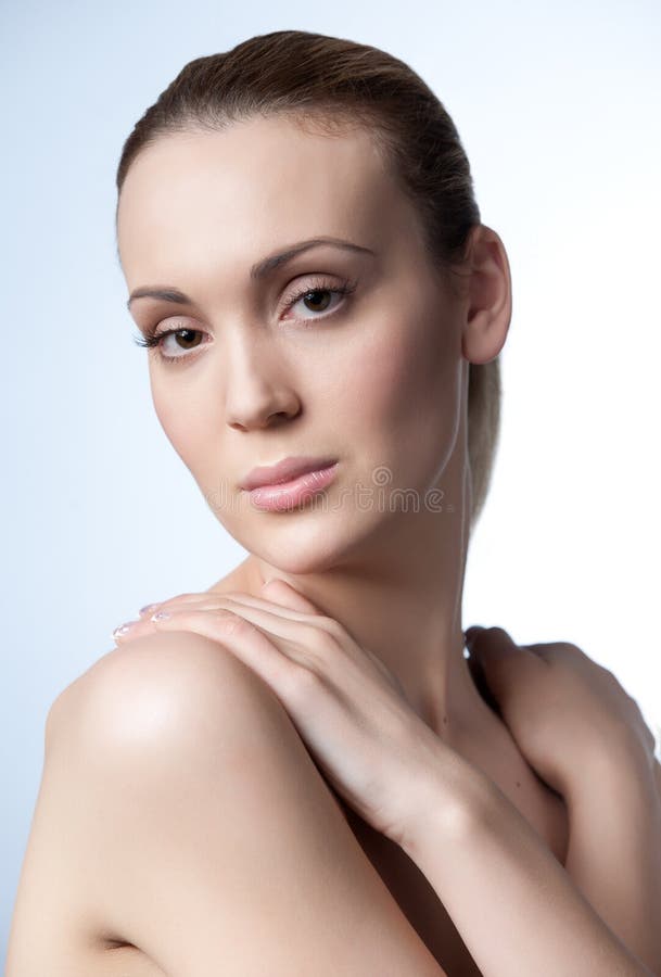 Female Beauty Vertical Portrait Shot With Nude Makeup On A White