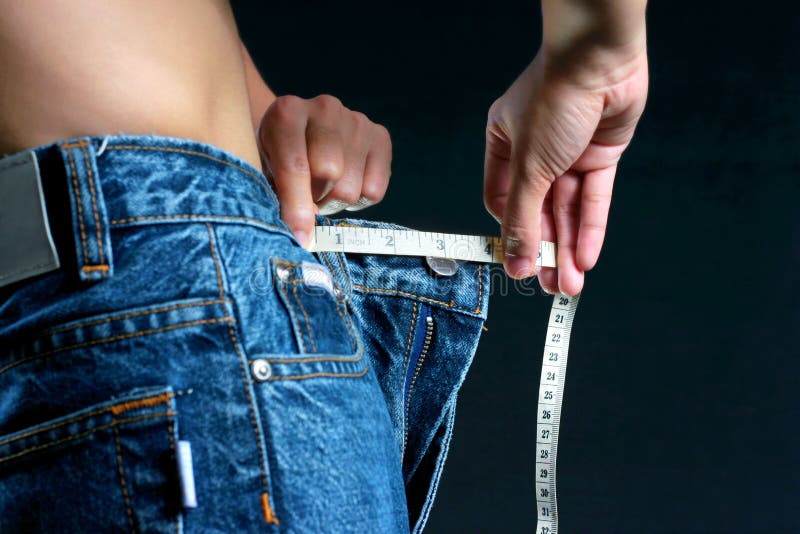 Female belly with tape measure stock photos