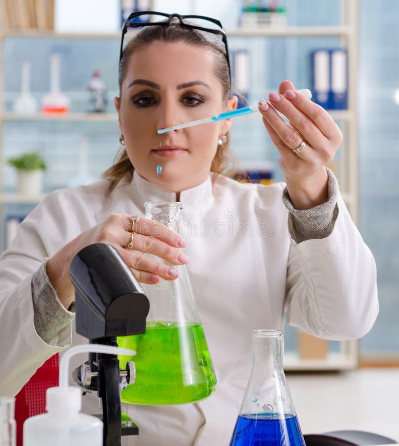 The Female Biotechnology Scientist Chemist Working in the Lab Stock