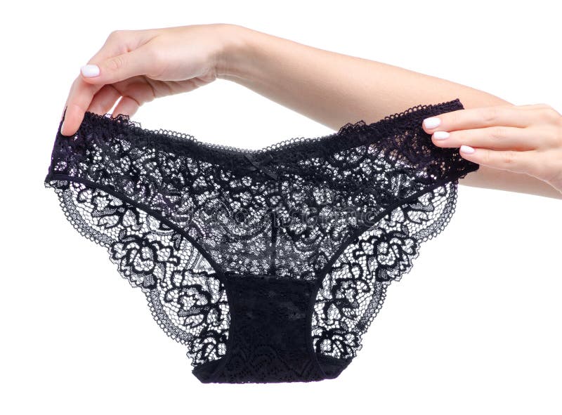 Female black lace panties in hand. 
