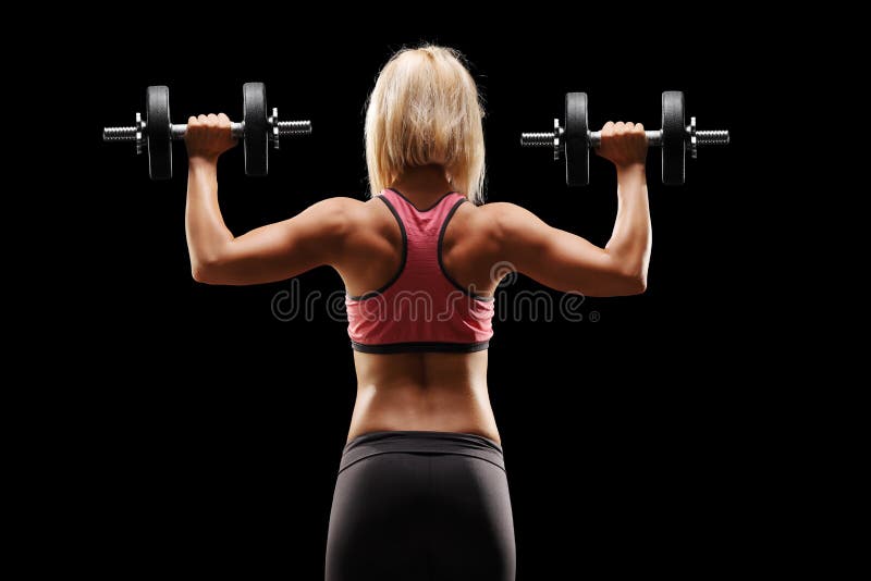 Female bodybuilder exercising with weights royalty free stock photos Female bodybuilder exercising with weights royalty free stock photos